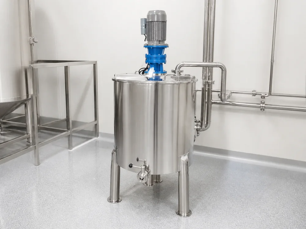 Stainless industrial mixing tank operating in a hygienic processing room